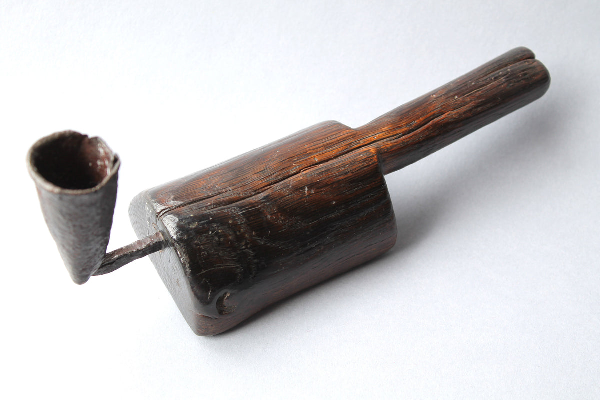 Unusual 18th century oak 'go to bed' candle holder