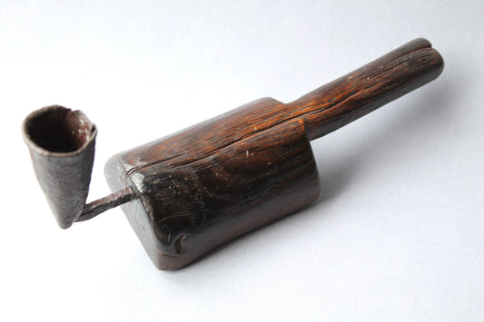 Unusual 18th century oak 'go to bed' candle holder
