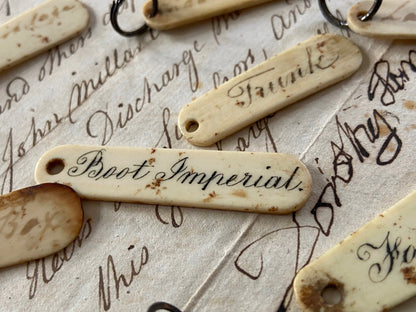 A set of mid 19th century ivory key labels