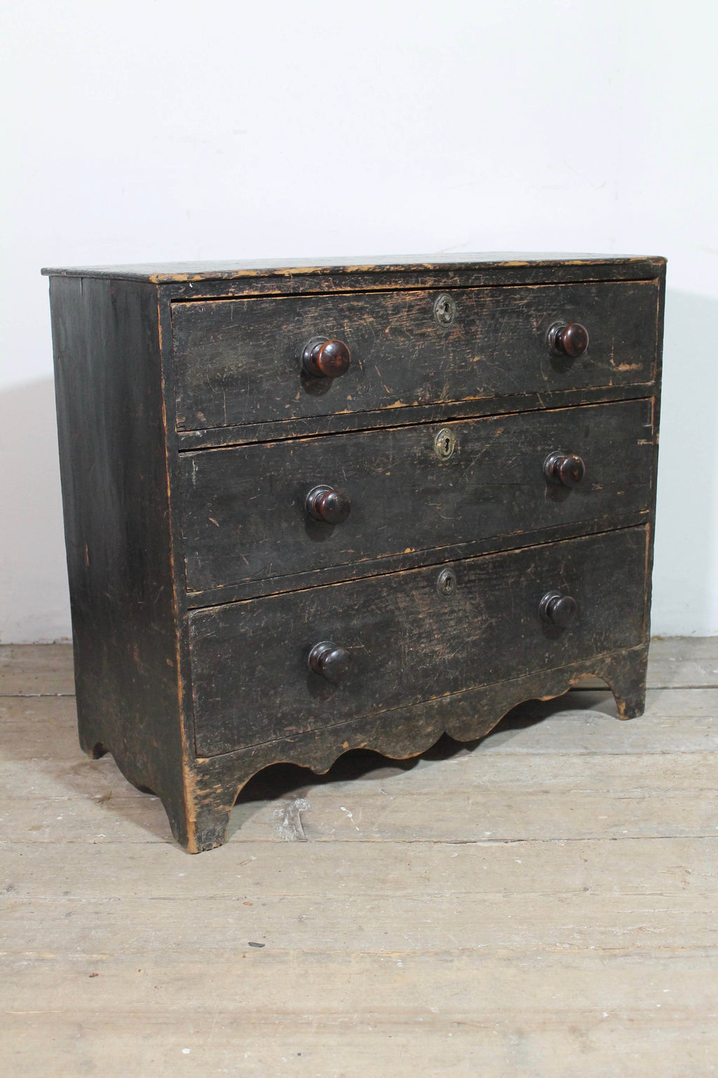 A George III chest of drawers of small proportions in original condition