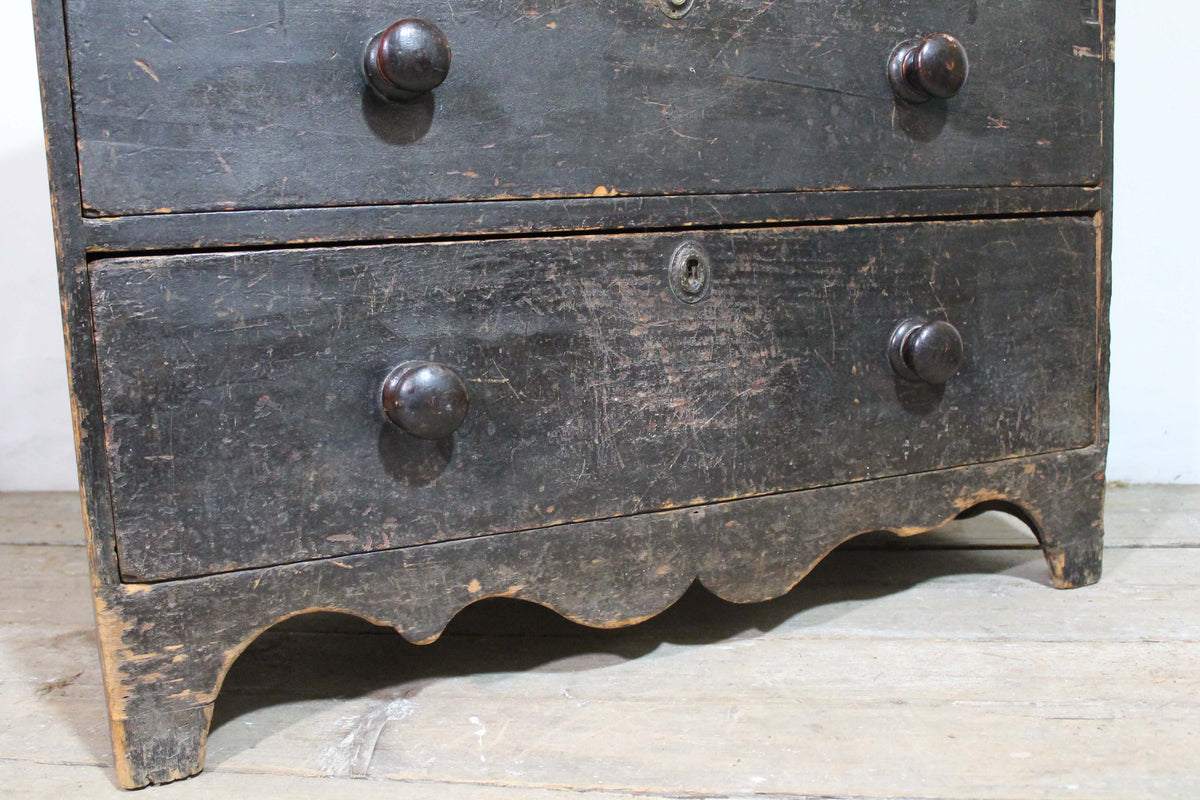 A George III chest of drawers of small proportions in original condition