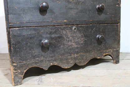 A George III chest of drawers of small proportions in original condition