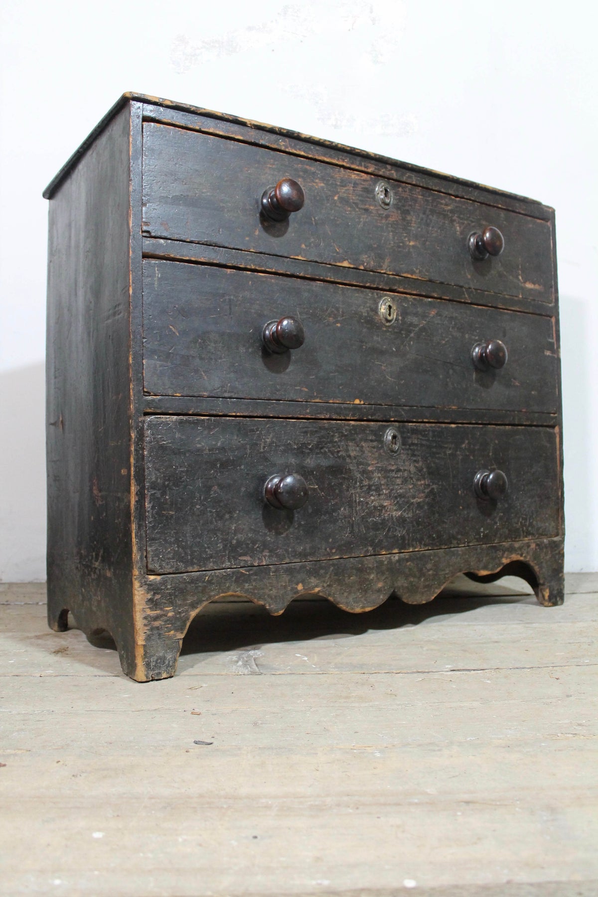 A George III chest of drawers of small proportions in original condition