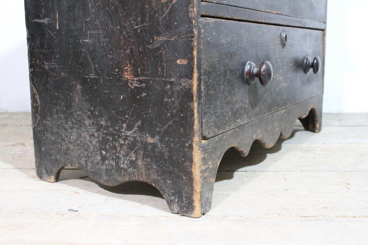 A George III chest of drawers of small proportions in original condition