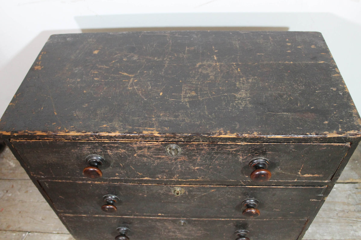A George III chest of drawers of small proportions in original condition