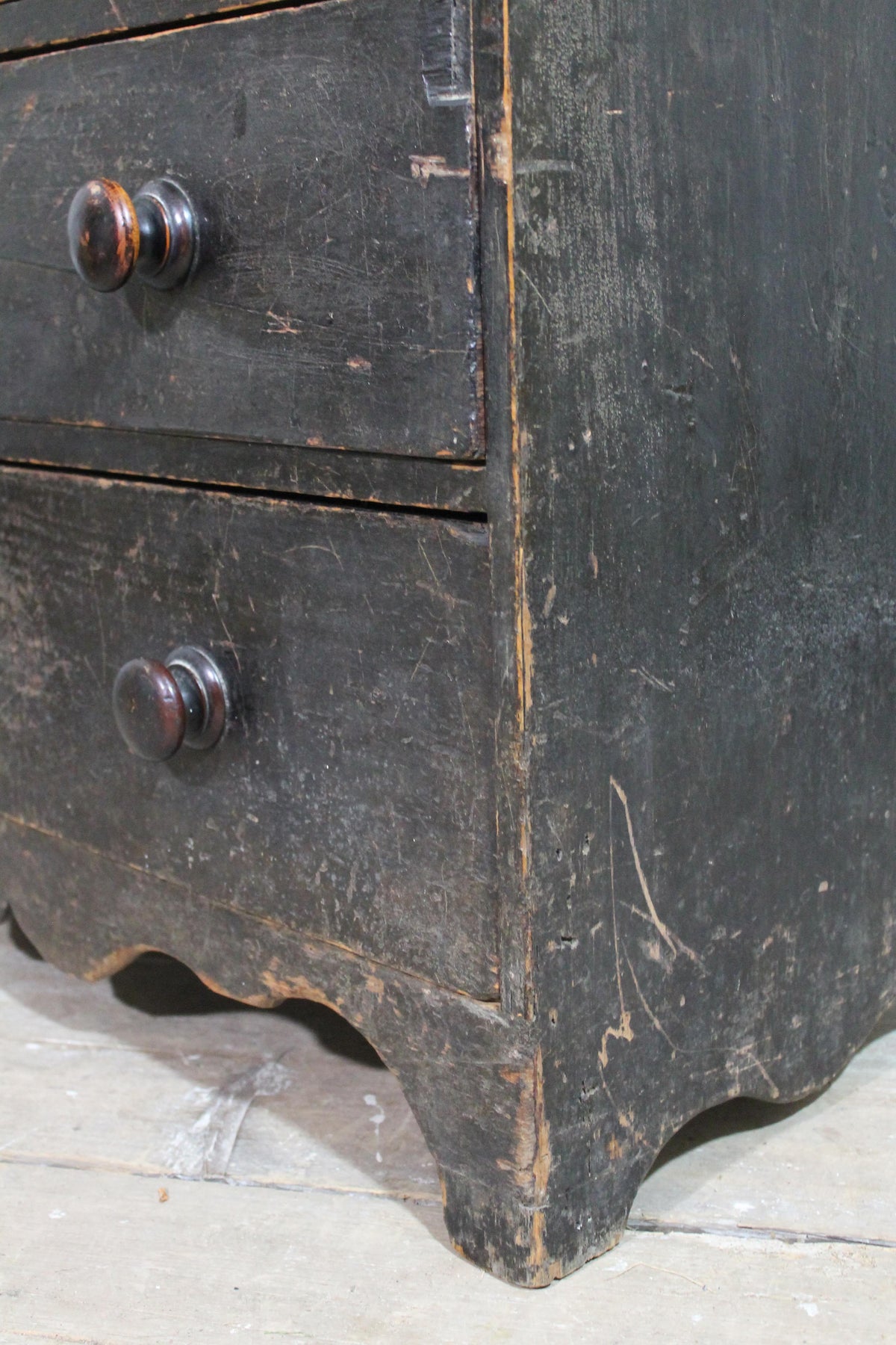 A George III chest of drawers of small proportions in original condition