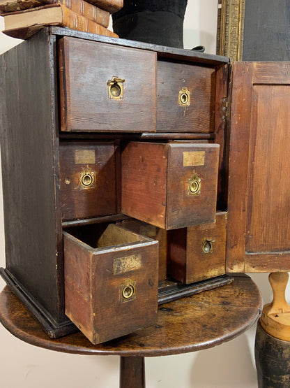 A delightful 19th century Welsh spice cabinet in the original finish