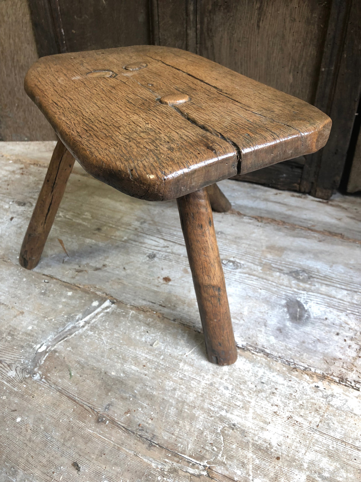 An excellent primitive George III three legged stool of good colour