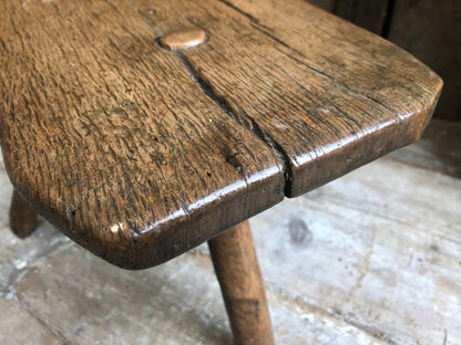 An excellent primitive George III three legged stool of good colour