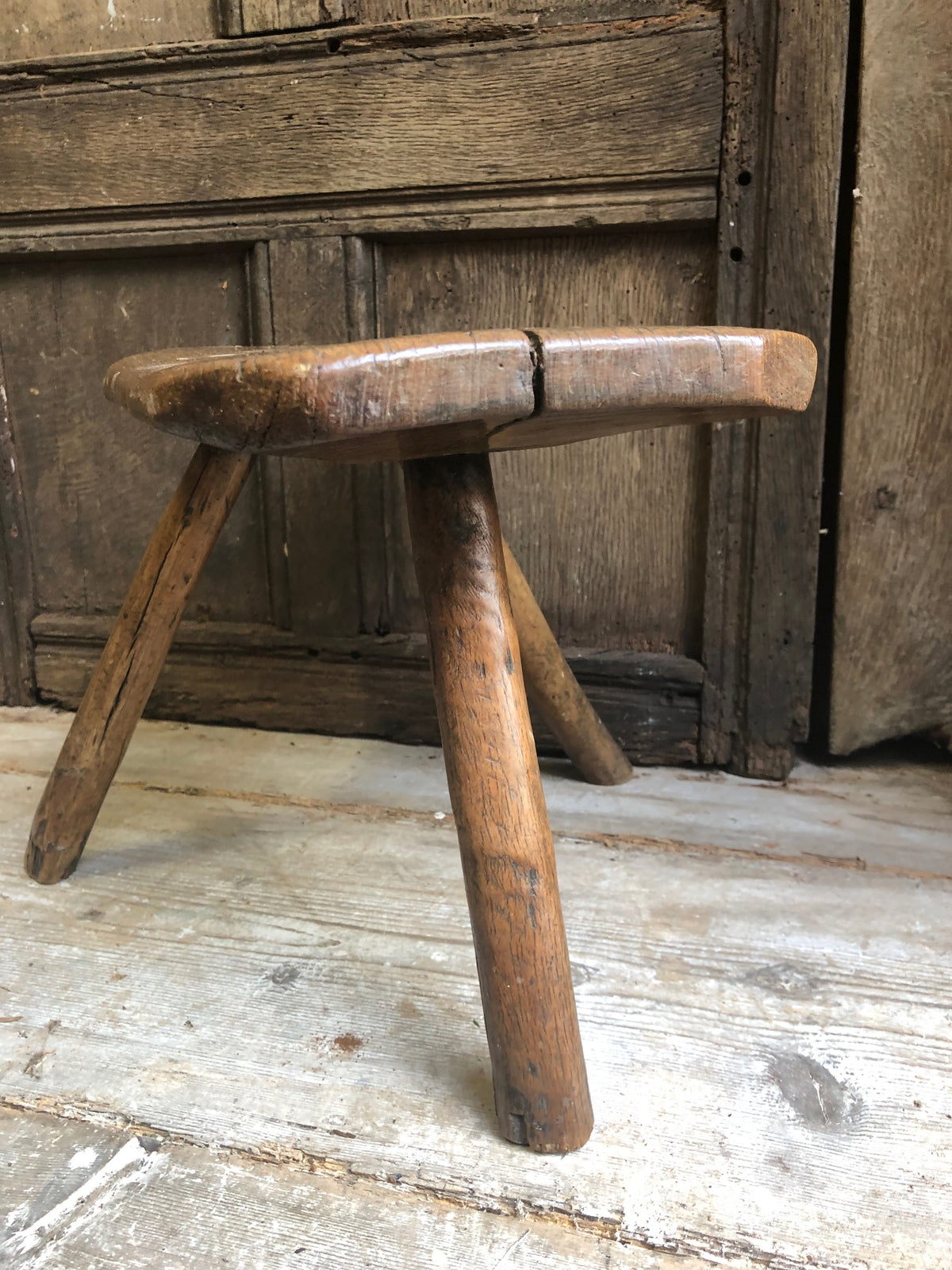 An excellent primitive George III three legged stool of good colour