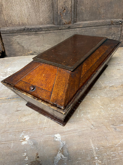 A Regency papier mache candle box in the form of a sarcophagus
