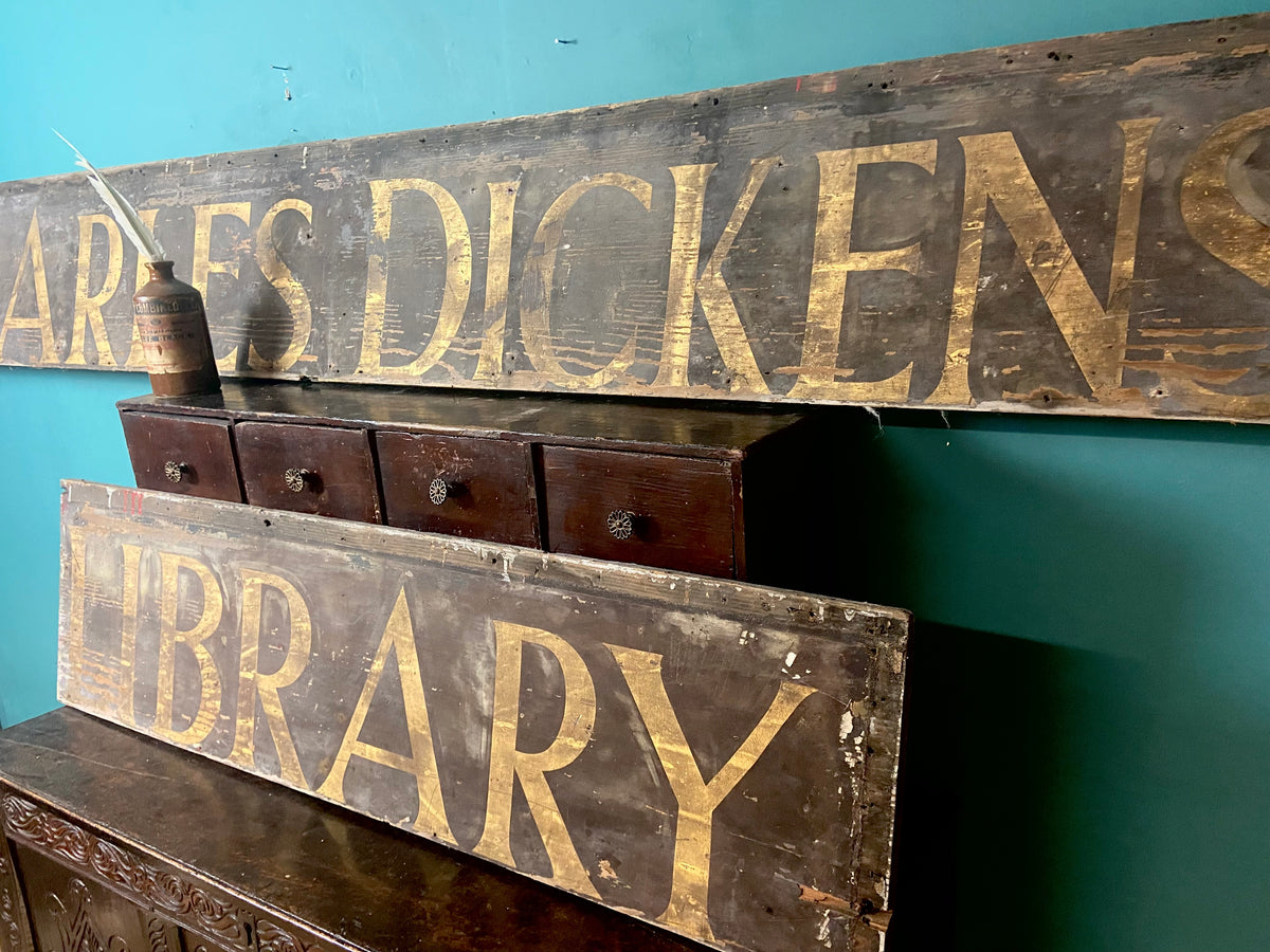 An original Victorian ‘Charles Dickens Library’ sign in the original gilt finish