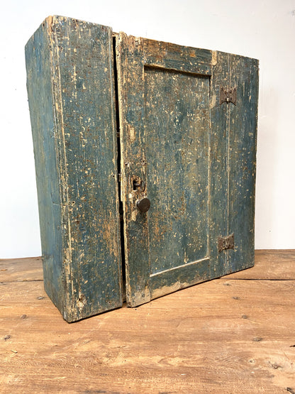 A small Georgian cupboard c. 1780 in the original blue paint