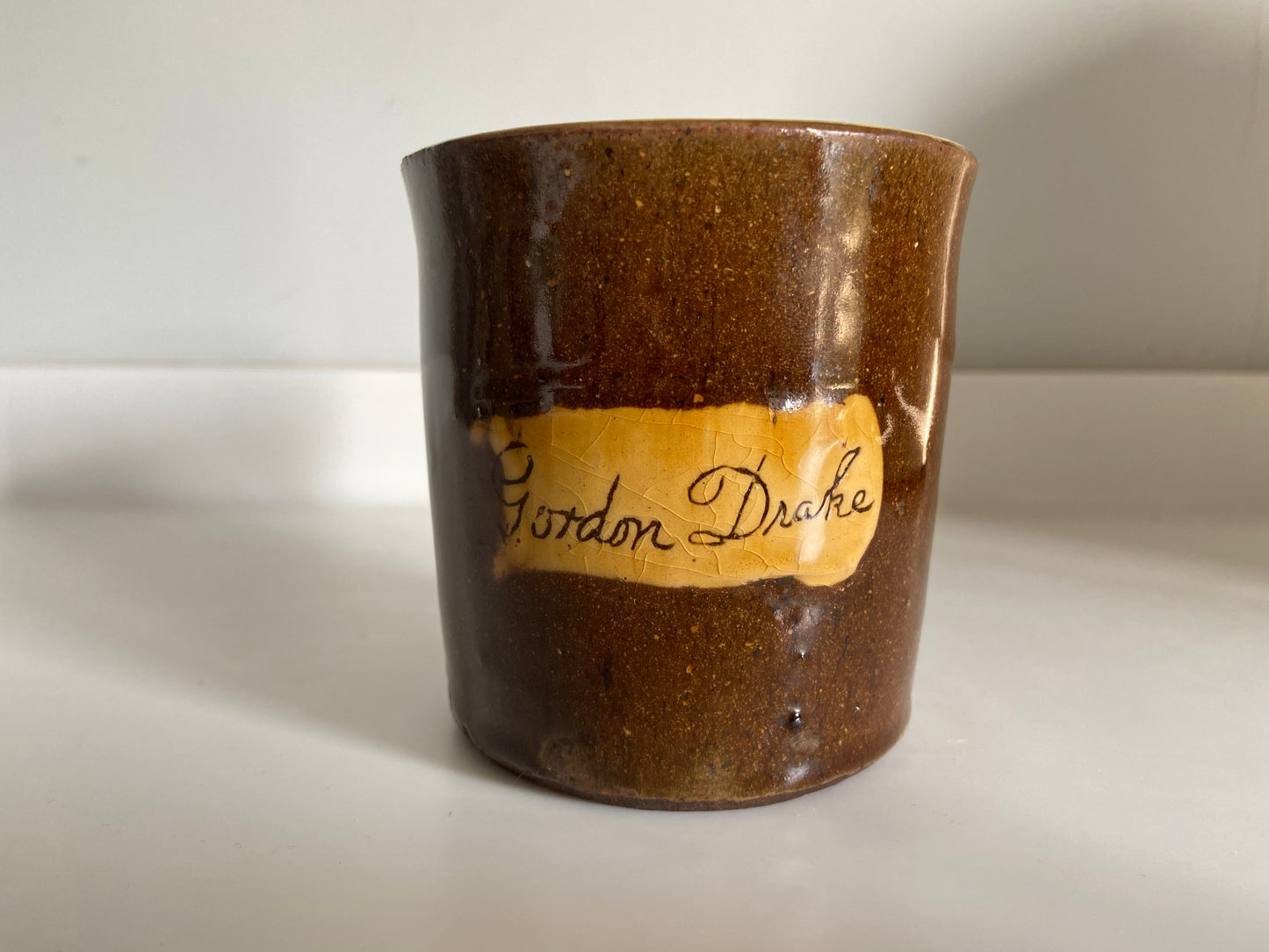 A slipware mug by Isaac Button of Soil Hill, Halifax