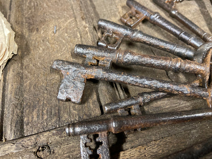 A set of 17th century large iron keys on original iron hoop