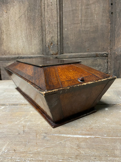 A Regency papier mache candle box in the form of a sarcophagus