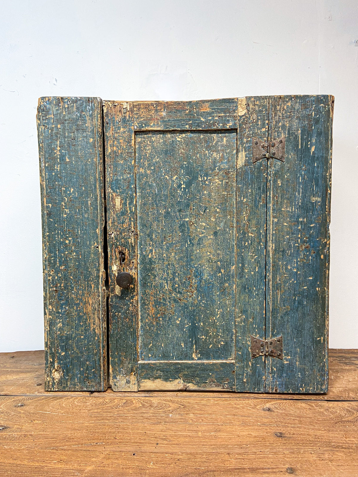 A small Georgian cupboard c. 1780 in the original blue paint