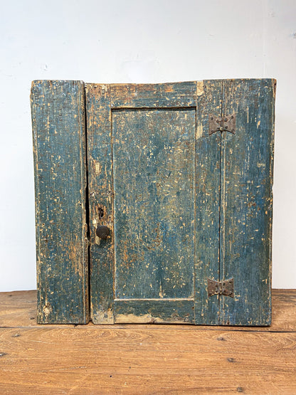A small Georgian cupboard c. 1780 in the original blue paint