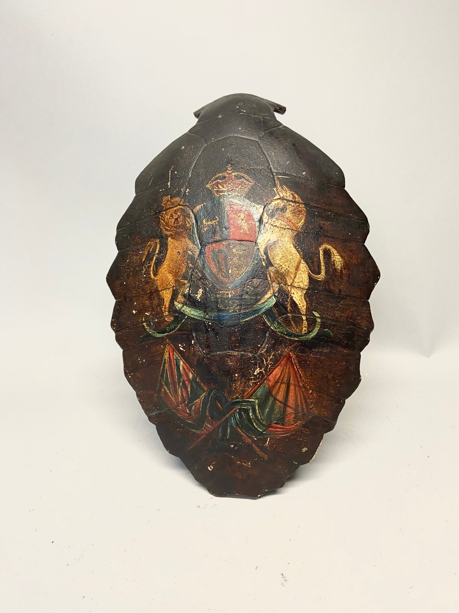 An early 19th century sailor’s hand painted turtle shell with hand painted Royal Standard