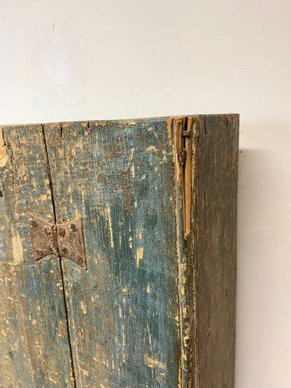 A small Georgian cupboard c. 1780 in the original blue paint