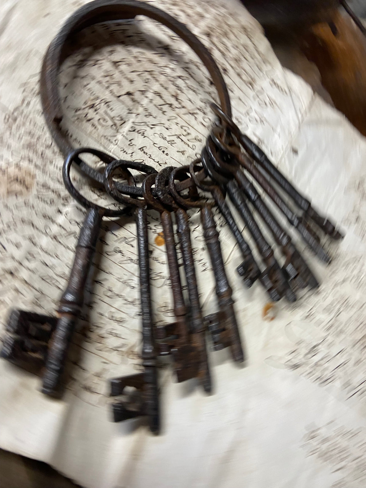 A set of 17th century large iron keys on original iron hoop