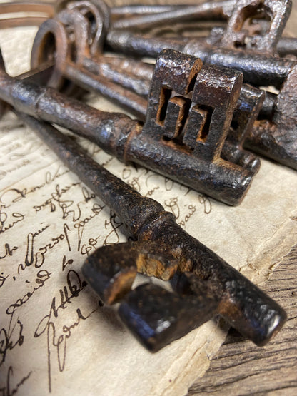 A set of 17th century large iron keys on original iron hoop