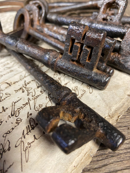 A set of 17th century large iron keys on original iron hoop