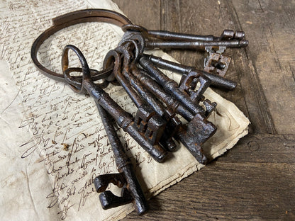A set of 17th century large iron keys on original iron hoop
