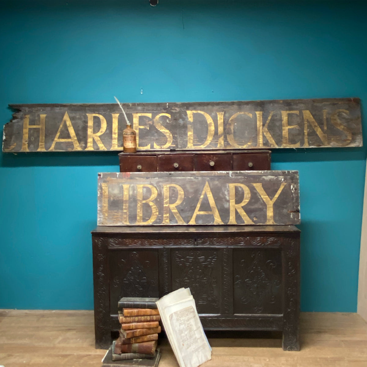 An original Victorian ‘Charles Dickens Library’ sign in the original gilt finish