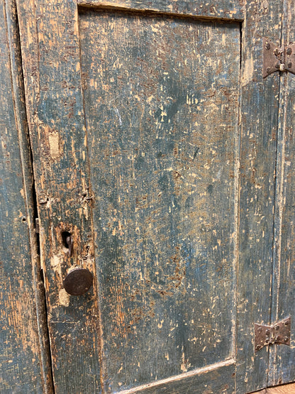 A small Georgian cupboard c. 1780 in the original blue paint
