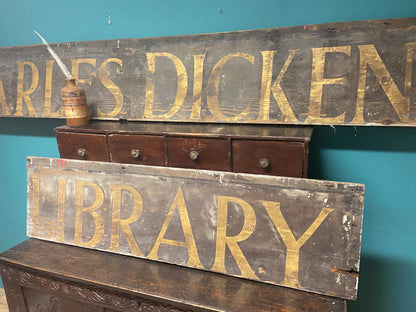 An original Victorian ‘Charles Dickens Library’ sign in the original gilt finish