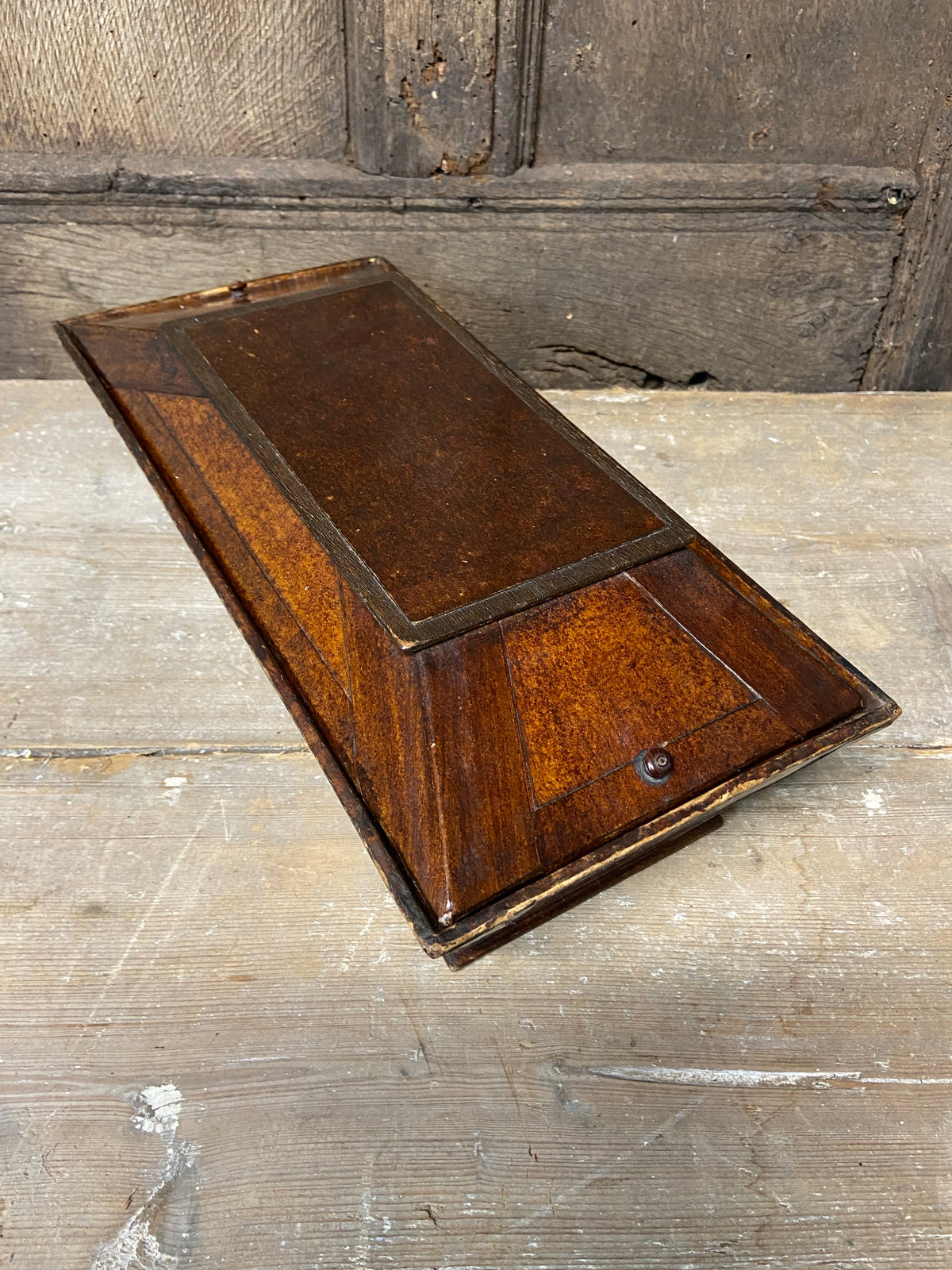 A Regency papier mache candle box in the form of a sarcophagus