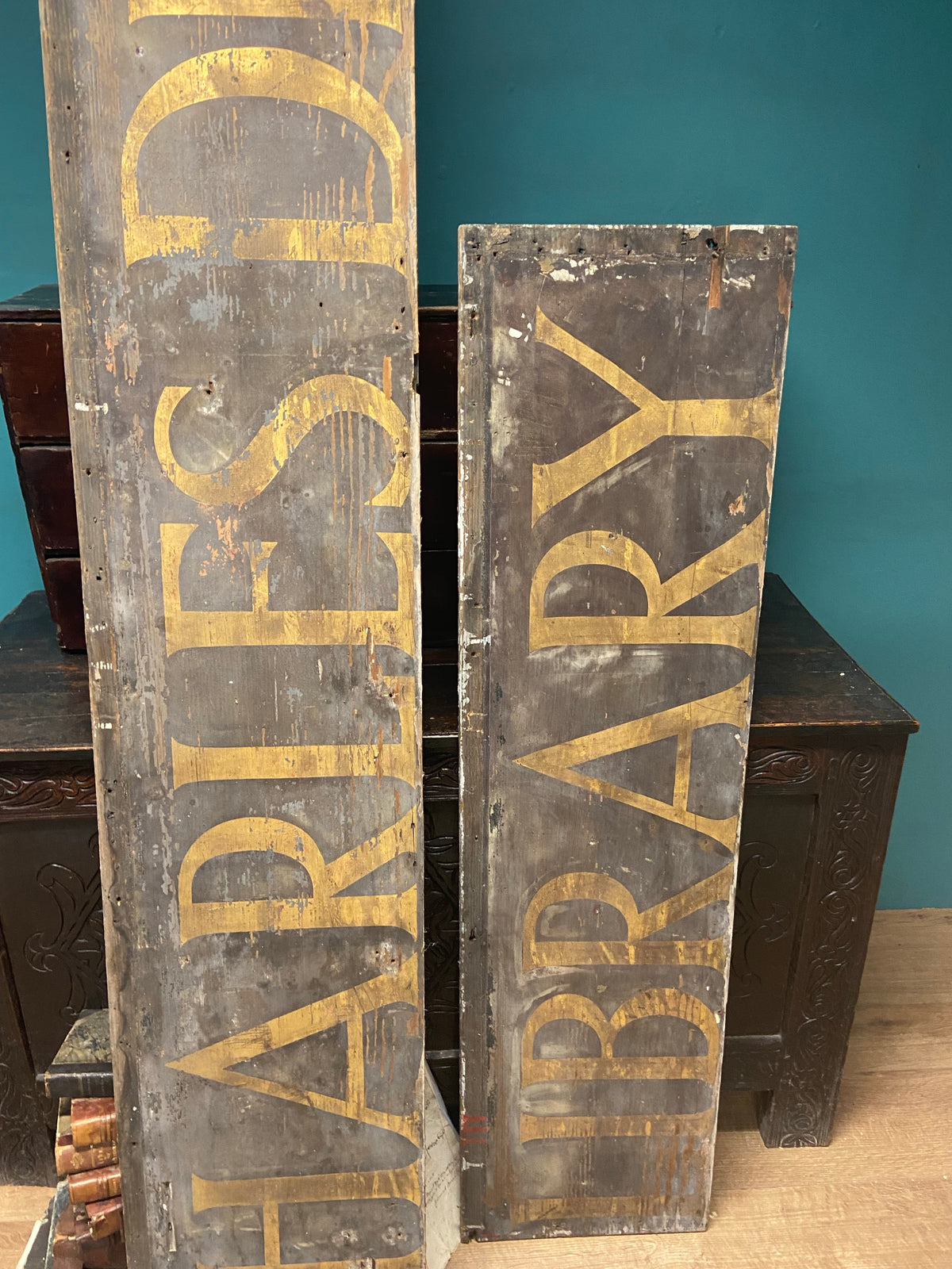 An original Victorian ‘Charles Dickens Library’ sign in the original gilt finish