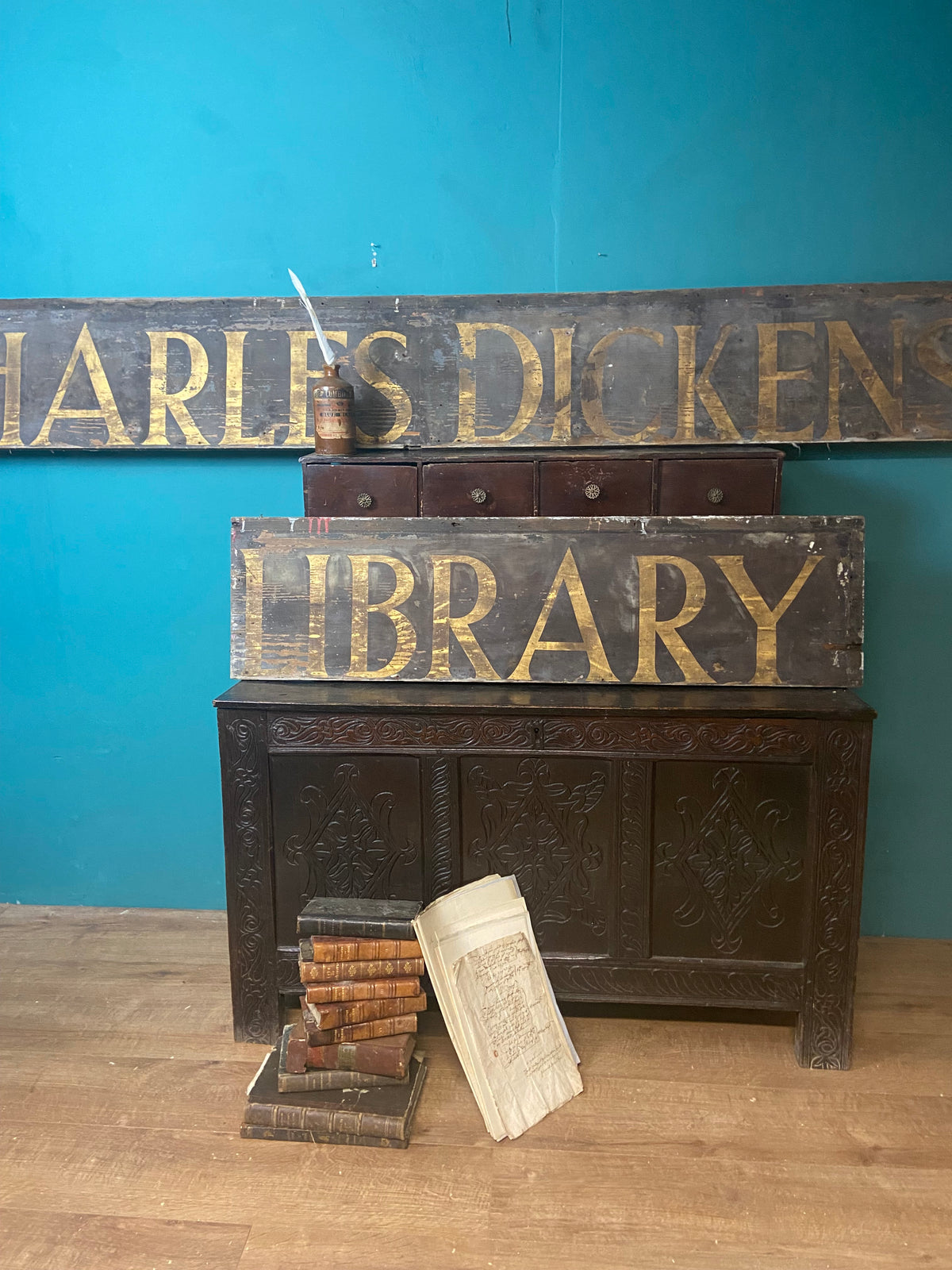 An original Victorian ‘Charles Dickens Library’ sign in the original gilt finish