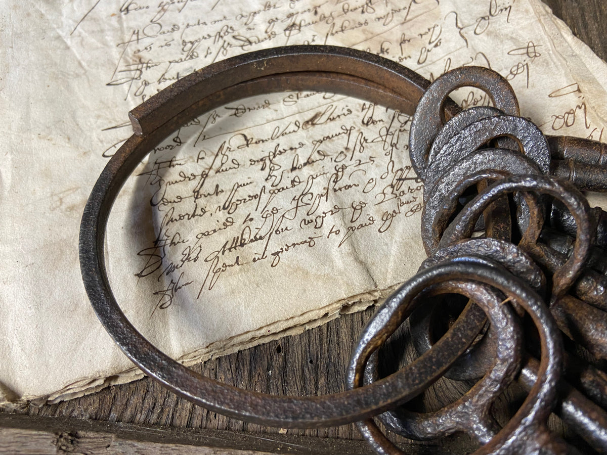 A set of 17th century large iron keys on original iron hoop