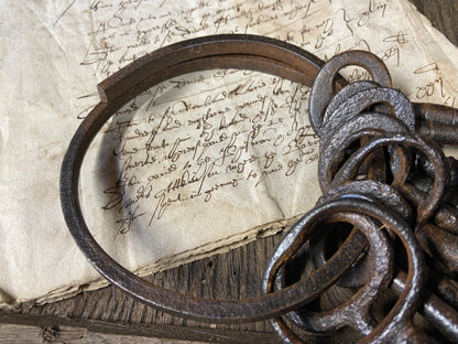 A set of 17th century large iron keys on original iron hoop
