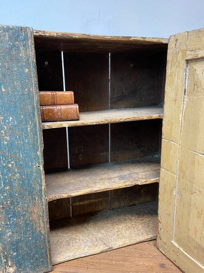 A small Georgian cupboard c. 1780 in the original blue paint