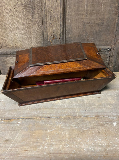 A Regency papier mache candle box in the form of a sarcophagus