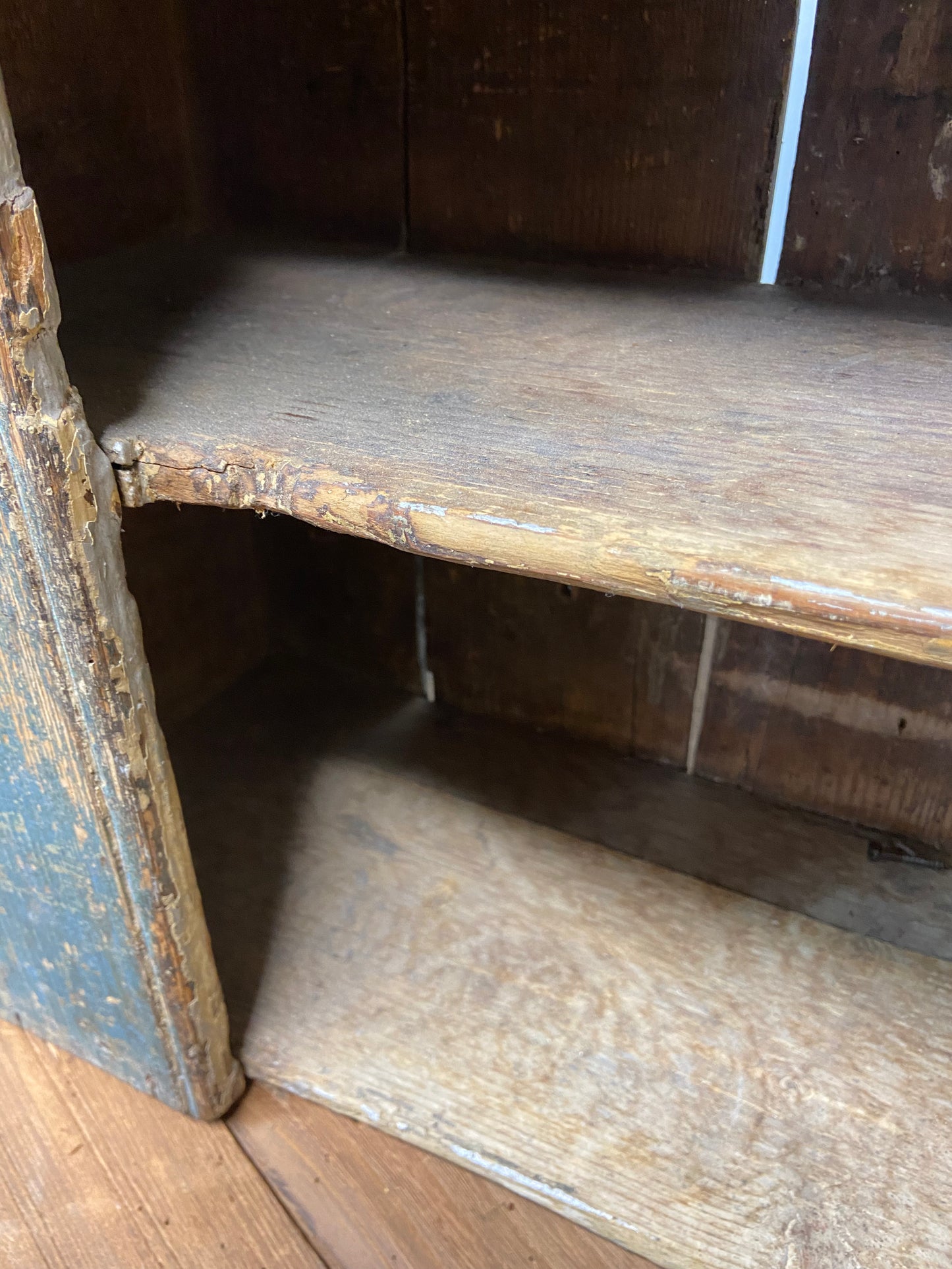 A small Georgian cupboard c. 1780 in the original blue paint