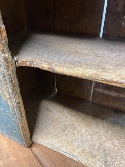 A small Georgian cupboard c. 1780 in the original blue paint