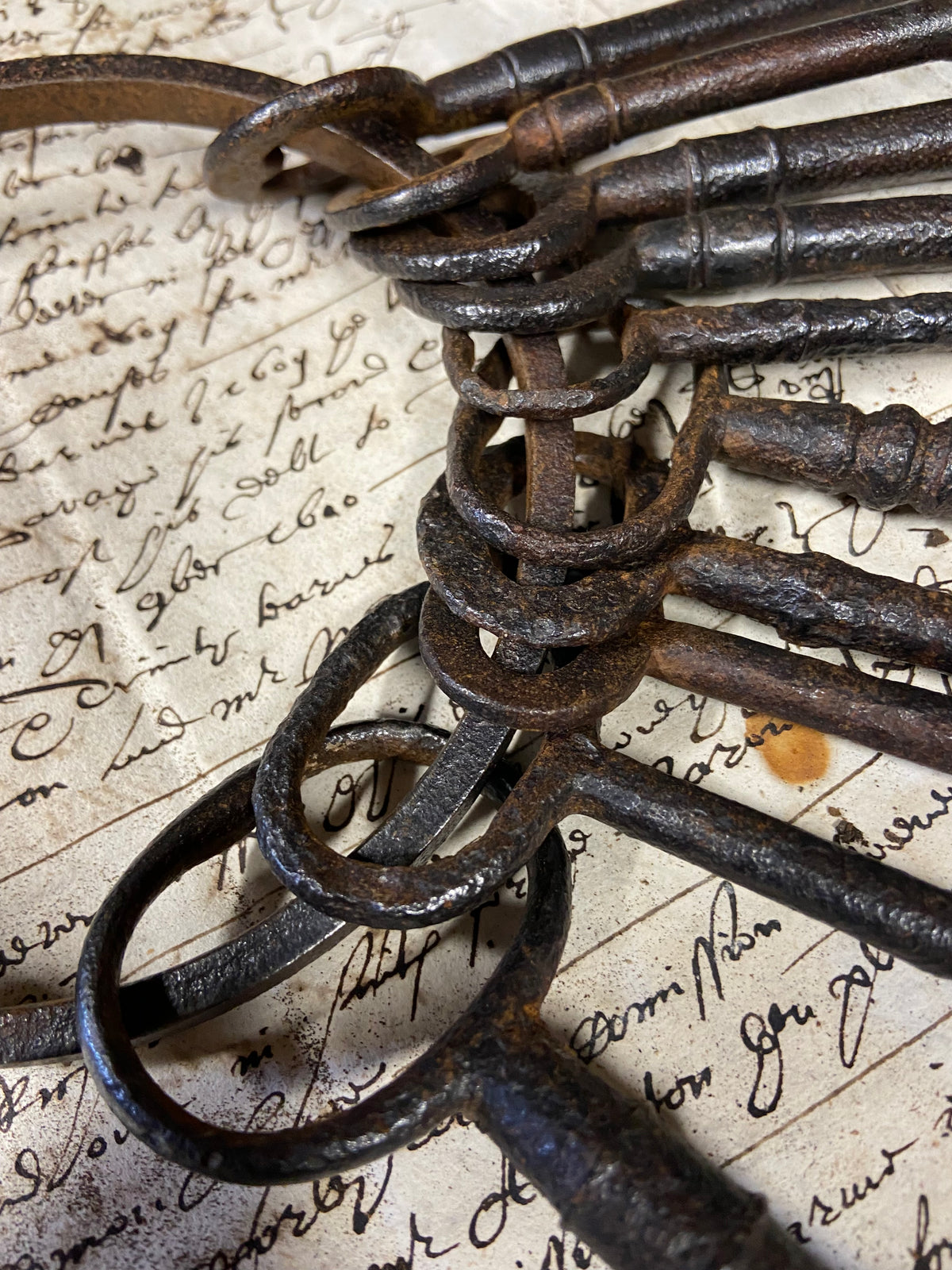 A set of 17th century large iron keys on original iron hoop