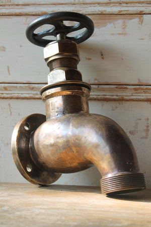 Early 20th c oversized brass tap